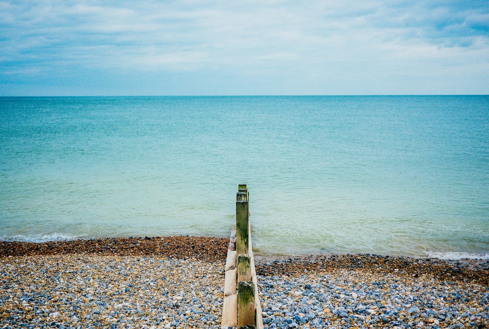 rocks near calm ocean