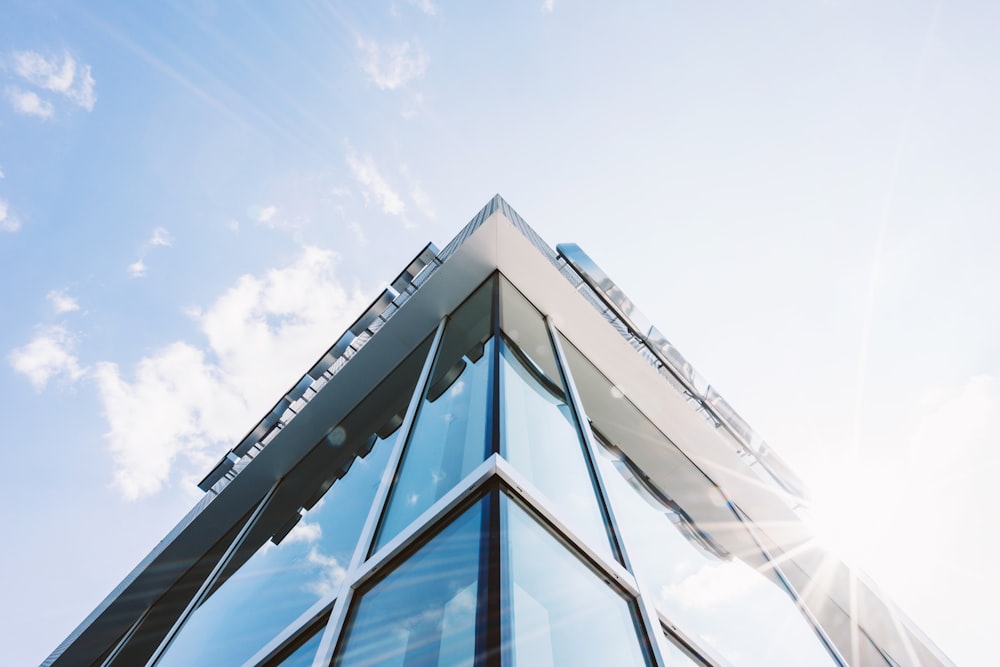 glass building wall under clear sky