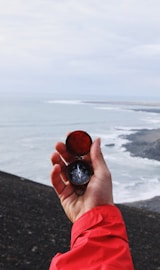 person holding compass