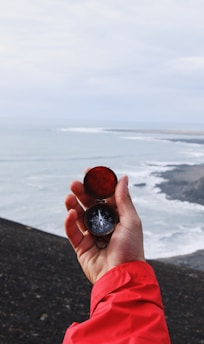 person holding compass