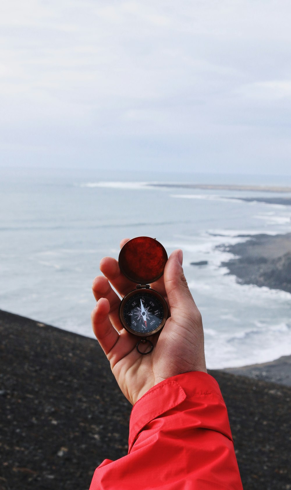 person holding compass