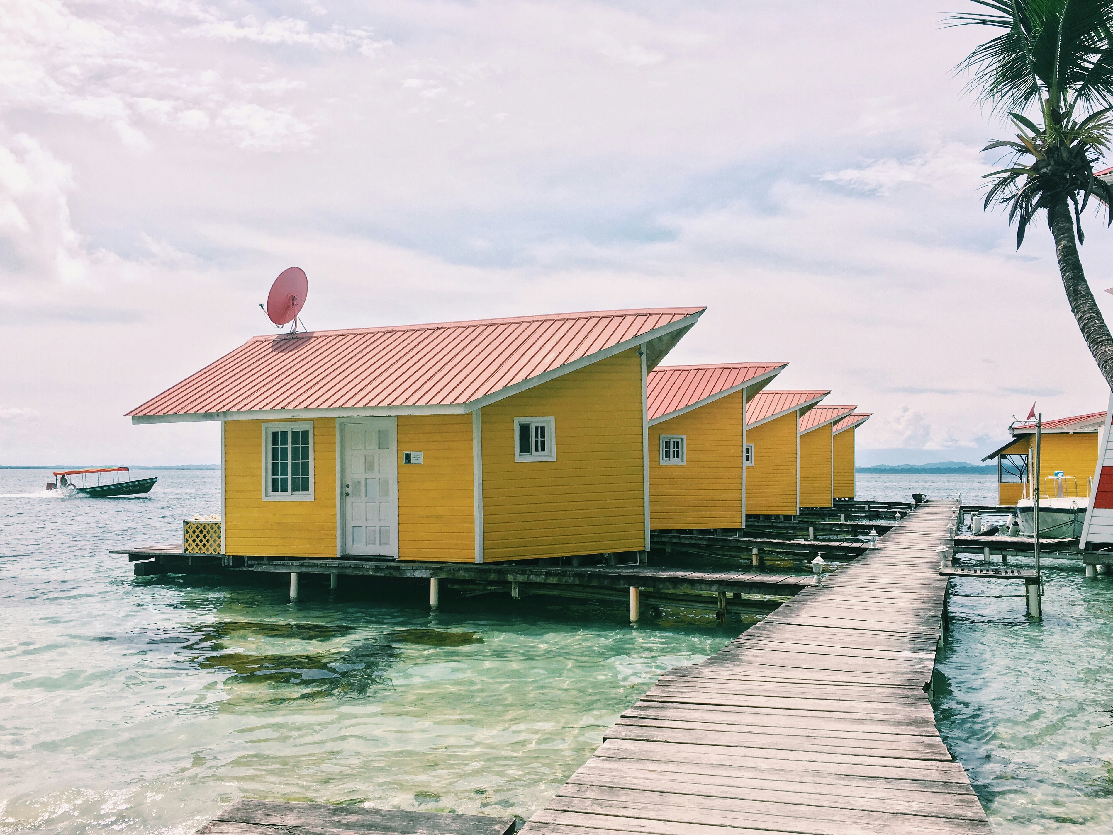 photo of brown houses on body of water