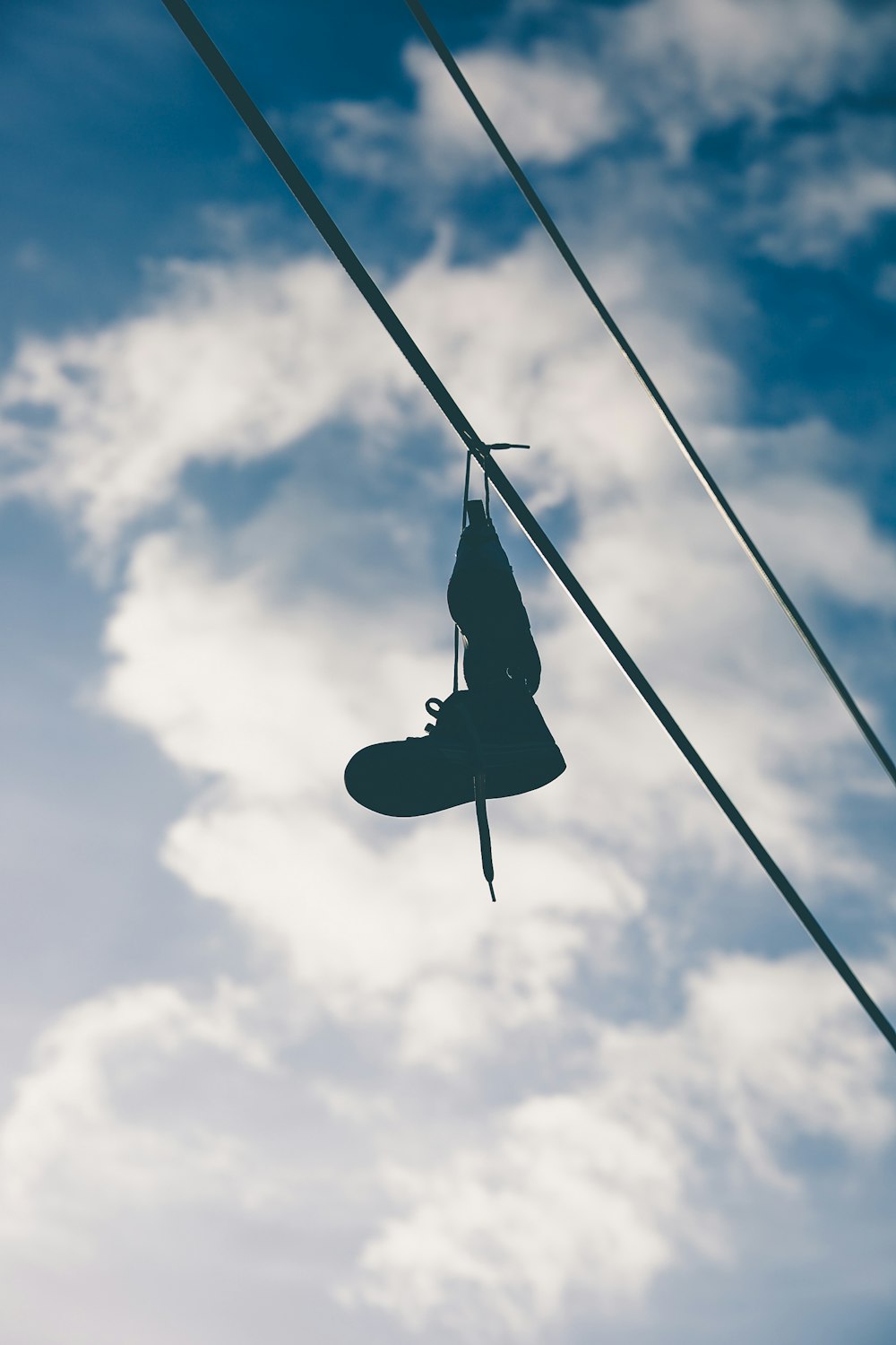 black boot hung on wire