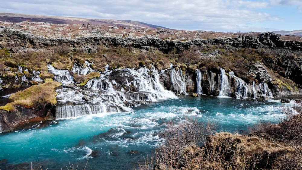 aerial photography of water falls at daytime