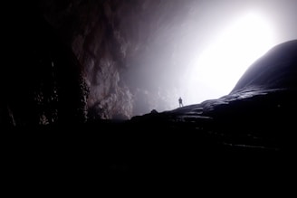 person inside of cave