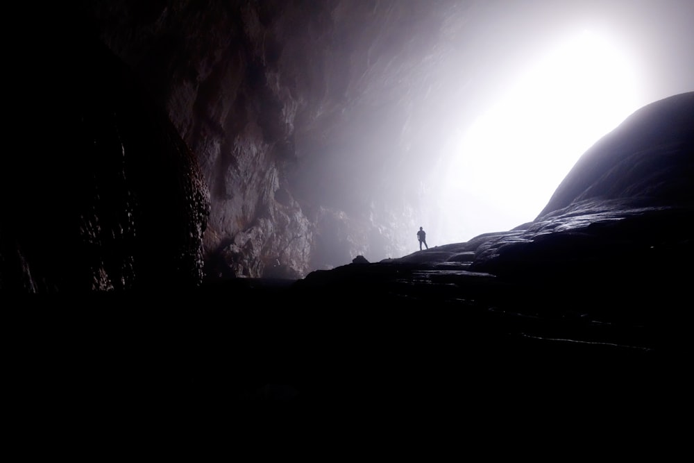 person inside of cave