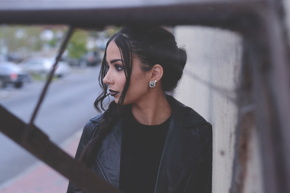 woman wearing black notched lapel top