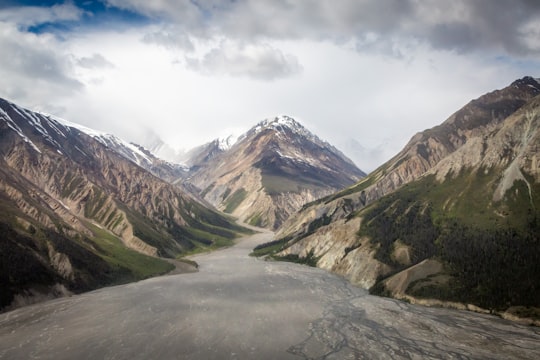 winding road through mountain in Kluane National Park and Reserve of Canada Canada