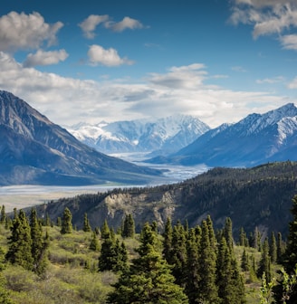 green mountain across body of water