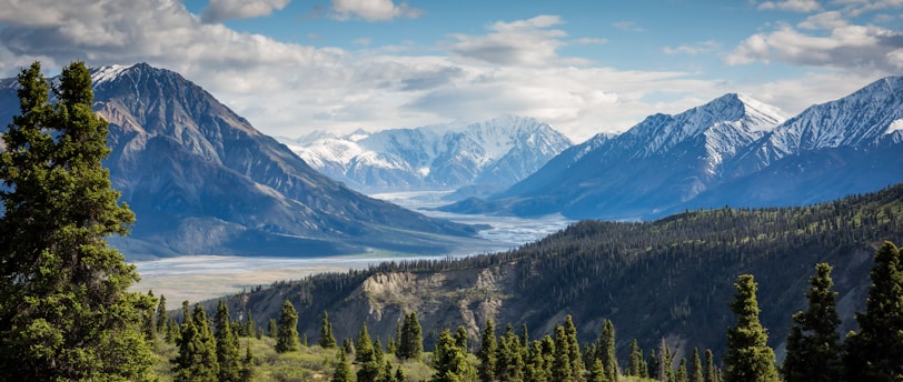 green mountain across body of water