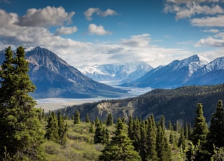 green mountain across body of water