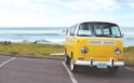 yellow Volkswagen T2 van on concrete road