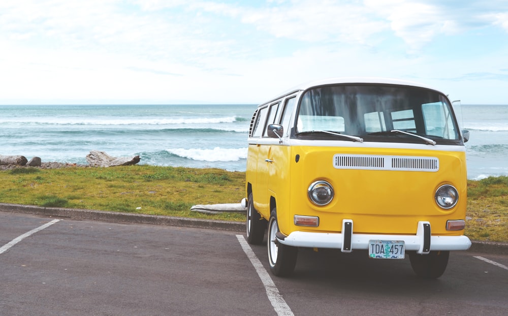 yellow Volkswagen T2 van on concrete road