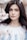 woman standing near white petaled flower