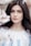 woman standing near white petaled flower