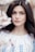 woman standing near white petaled flower