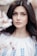 woman standing near white petaled flower