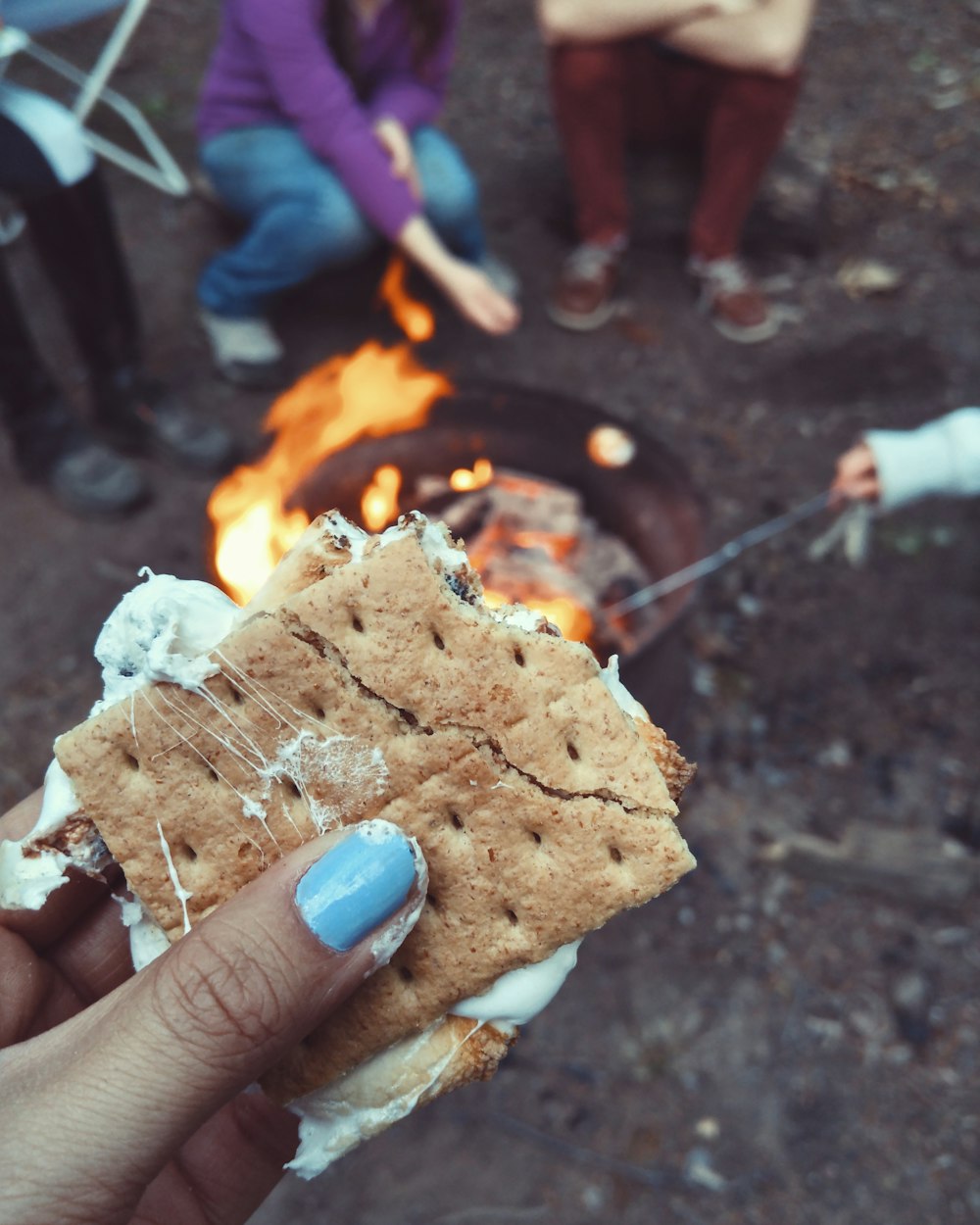 woman holding biscuit