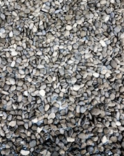 Close-up of assorted driveway stones and aggregates neatly arranged.