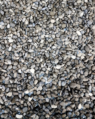 Close-up of assorted driveway stones and aggregates neatly arranged.