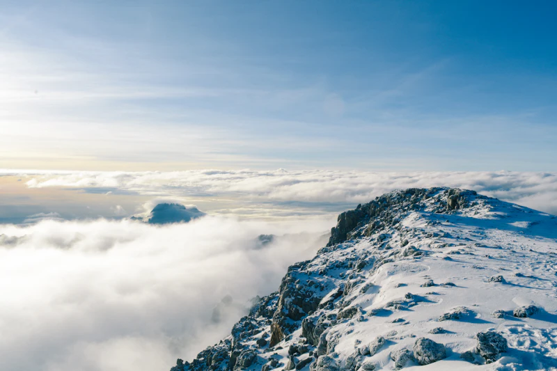 Kilimanjaro summit rising above a sea of clouds