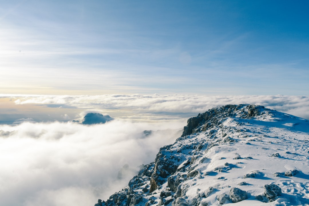 mountain covered by snow near sea of clouds, Snowy Mountains In Sky