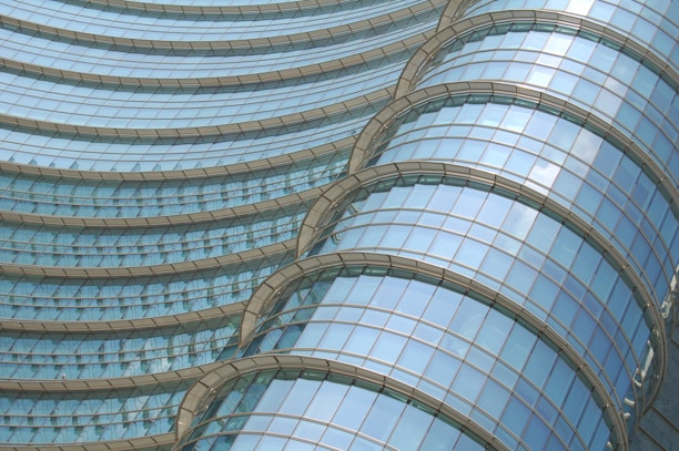 Contemporary facade with laminated glass domes and aluminum details.