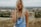 woman standing on top of a hill