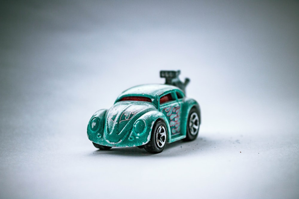 green and white car scale model