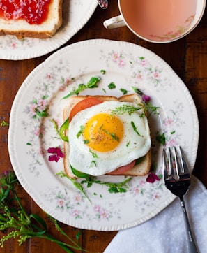 sunny-side up egg with bread beside fork