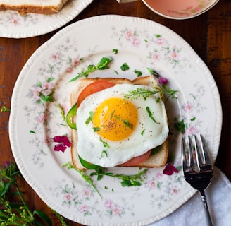 sunny-side up egg with bread beside fork