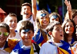 A joyful group of children with decorated faces.
