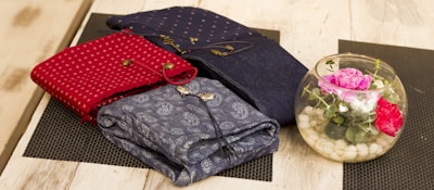 A coordinated set of three pieces laid out neatly on a soft fabric background.