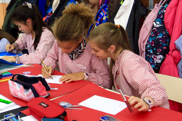 Children happily engaged in colorful biblical activity sheets at a cozy table.