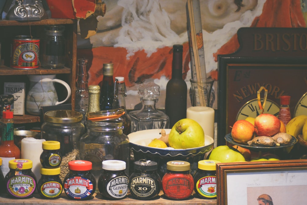 assorted jars and vegetables on table