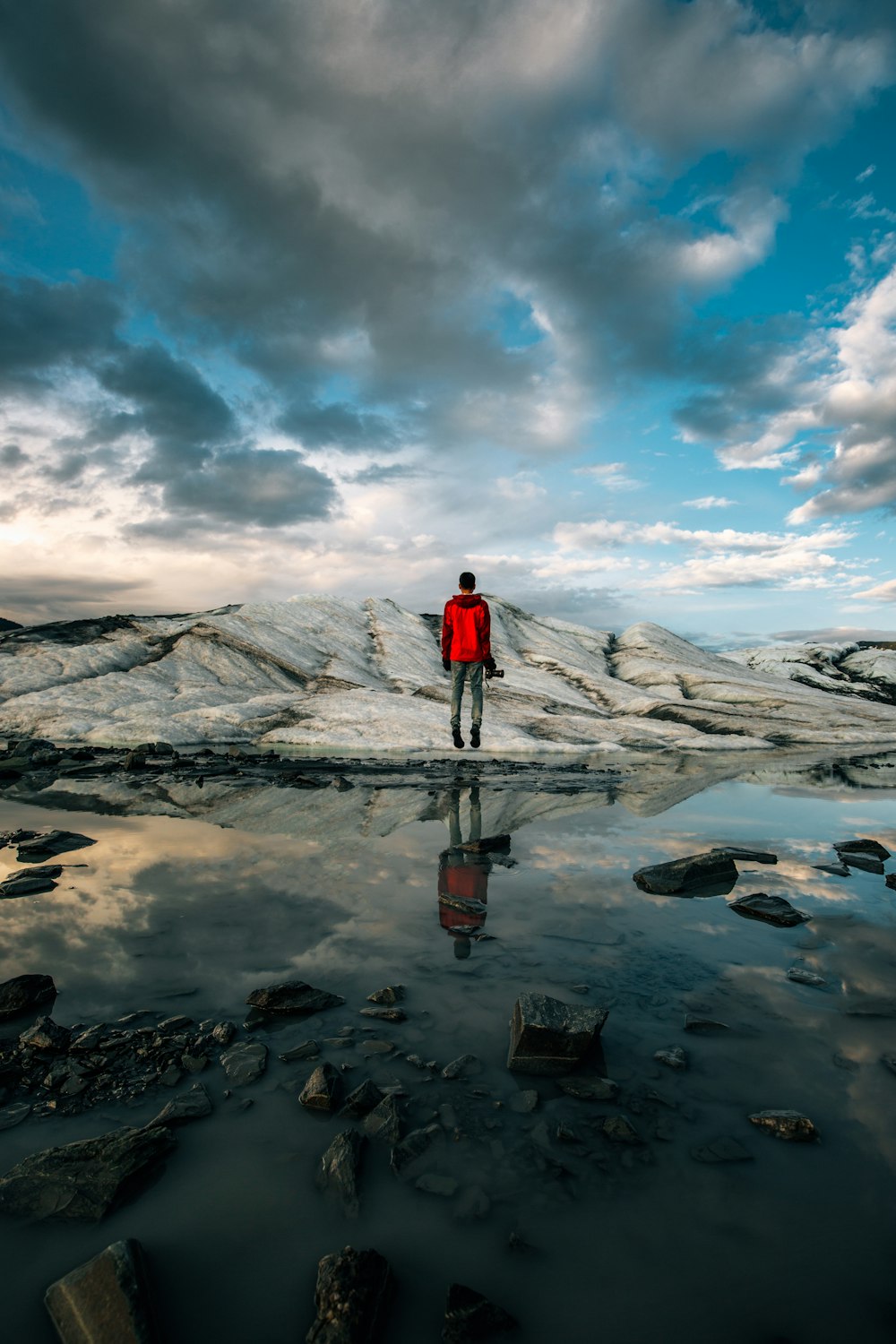 man standing near body of water of water