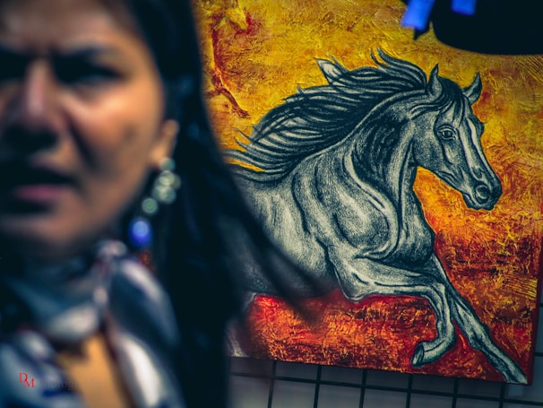 A dynamic capture of a muscular horse mid-stride, embodying strength and the essence of equestrian passion.