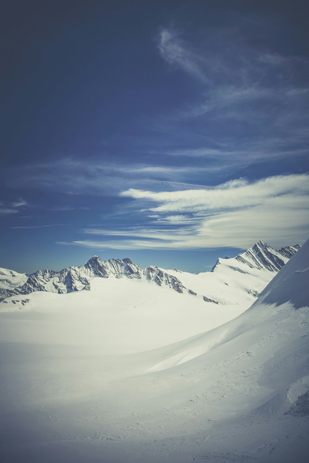 snow covered mountain under blue sky