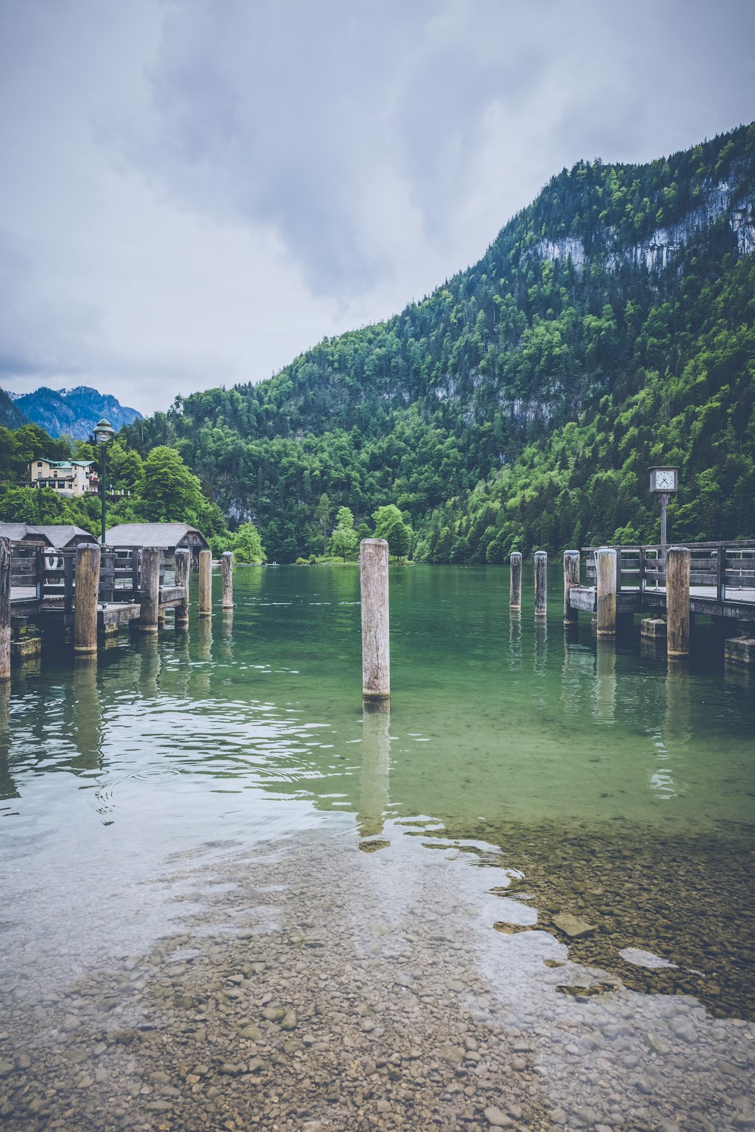 white post on body of water