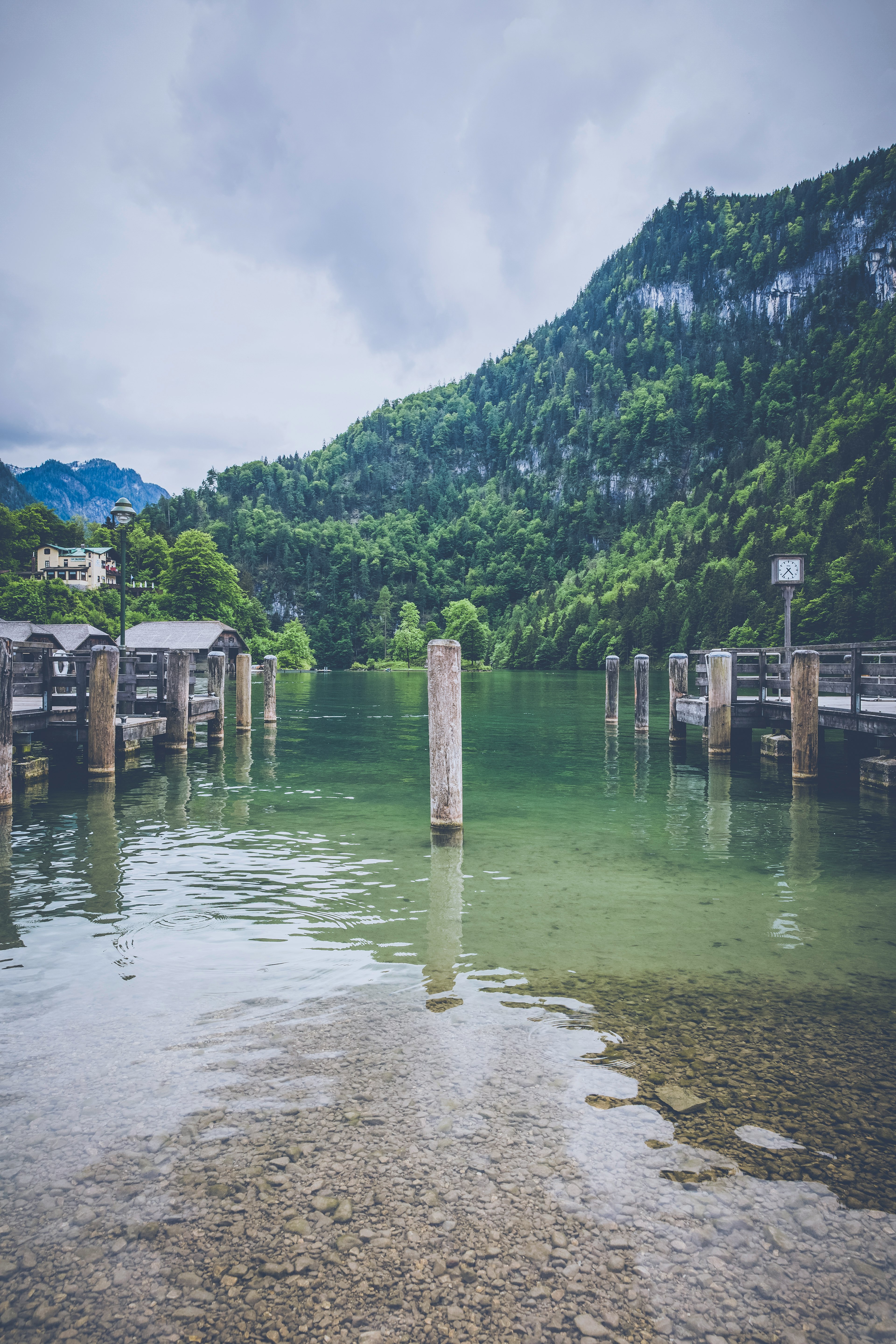 white post on body of water