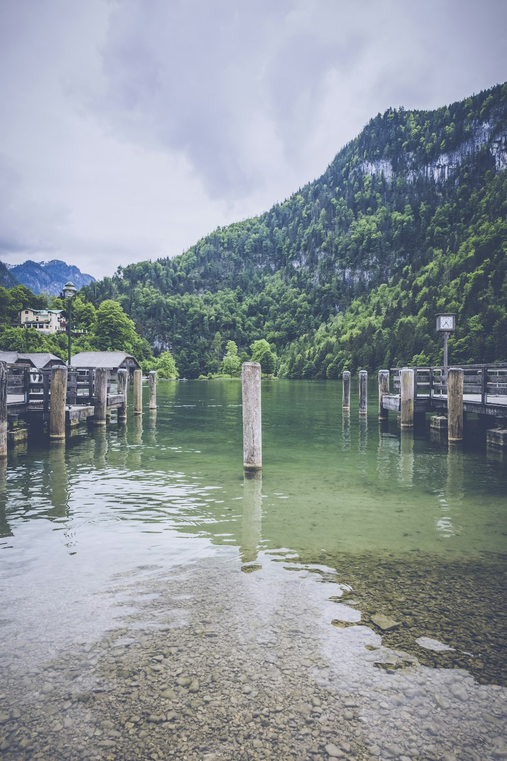 white post on body of water