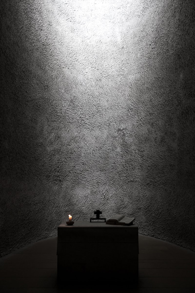 A candlelit corner resting in shadow — photo by Jonas Off on Unsplash