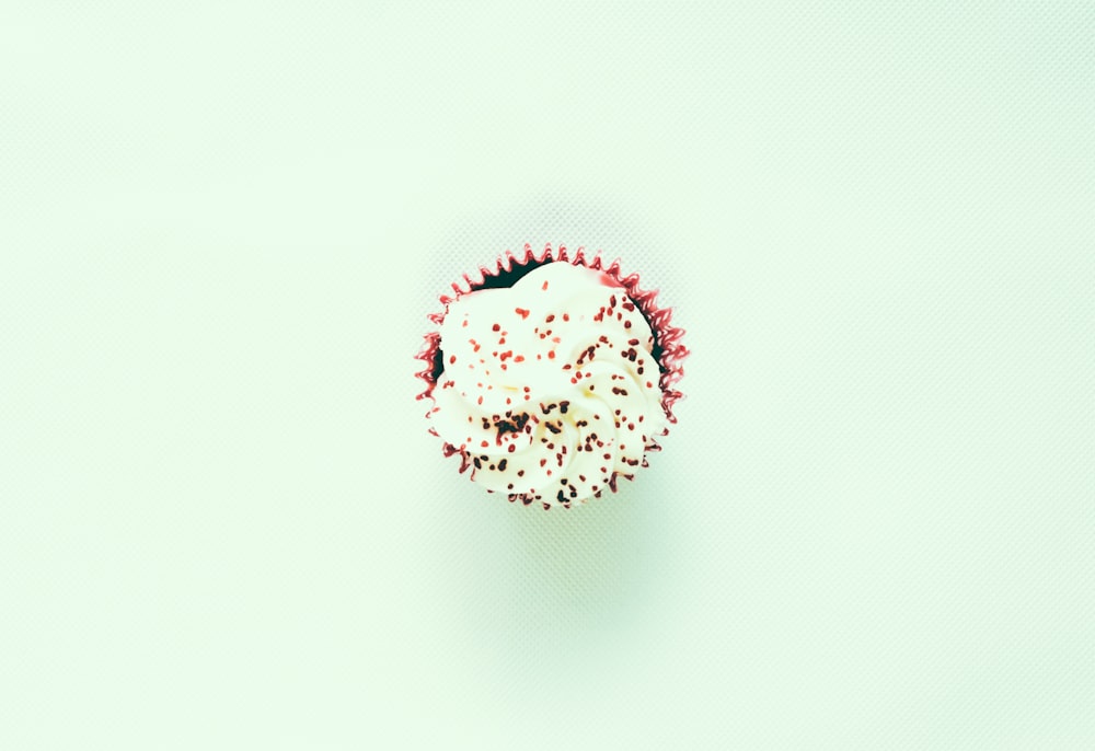 shallow focus photo of white cupcake