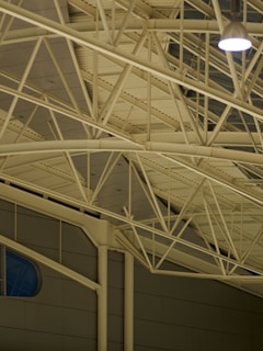 A stunning metal truss installation in a modern building.