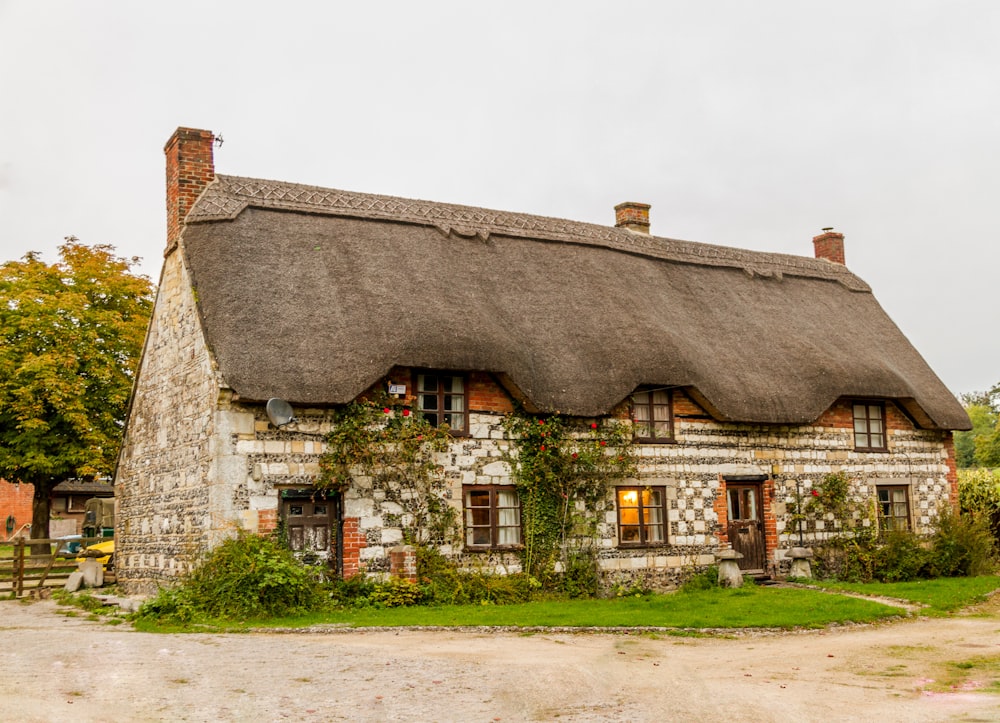 Cozy country cottage with thatched roof in England