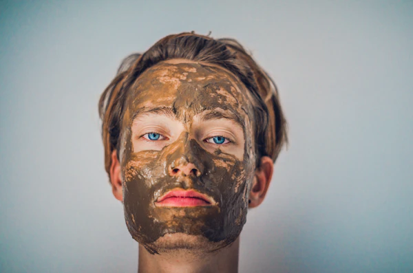 Guest wearing a clay mask