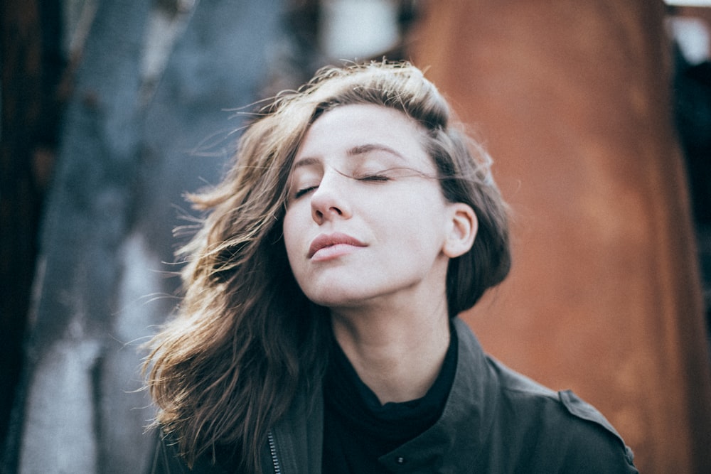 closeup photo of woman wearing black top