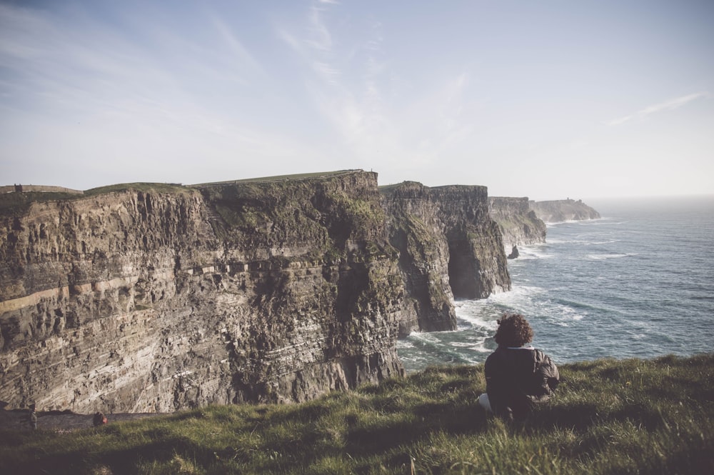 photo of cliff near sea during daytime