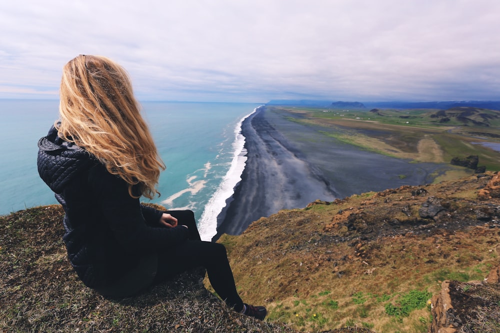 woman looking at seashore