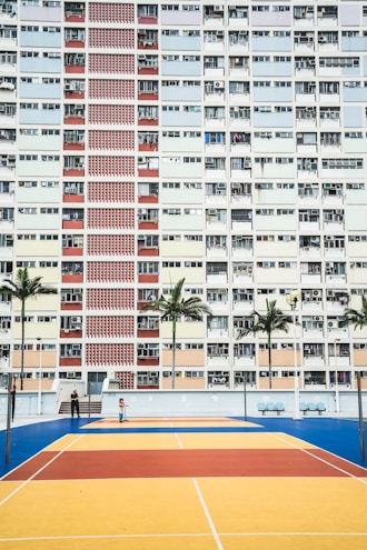 white wall paint high-rise building during daytime